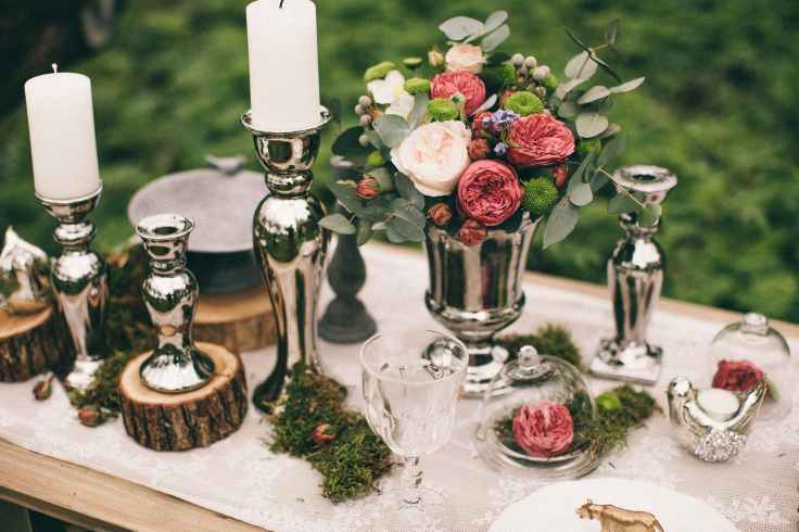 silver candle holders on a table