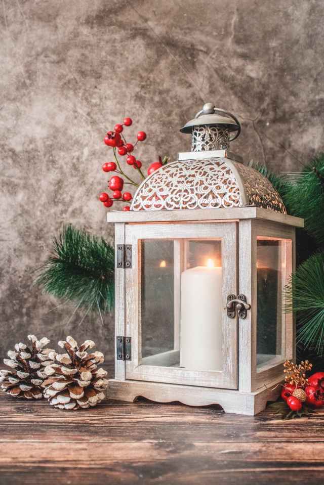 candle holder beside christmas tree